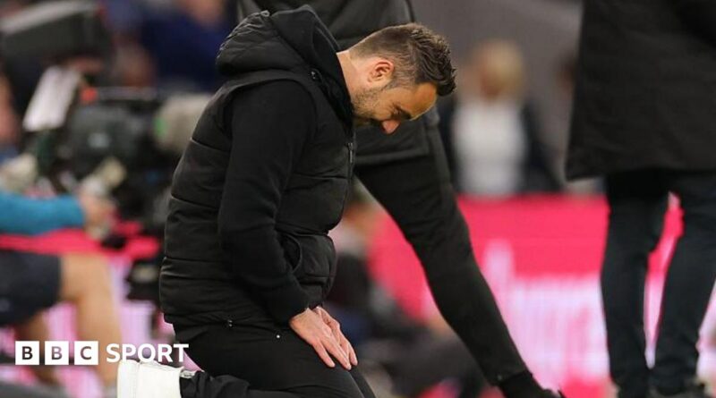 Roberto De Zerbi slumps to his knees during Tottenham Hotspur's draw at home to Leeds United.