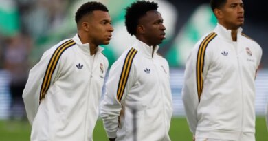 Real Madrid's Kylian Mbappe, Vinicius Junior and Jude Bellingham line up before a La Liga match