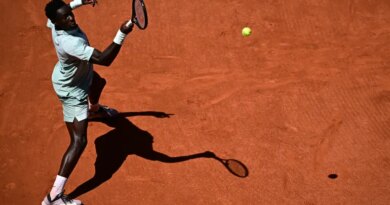 France's Moise Kouame plays a forehand return to Croatia's Marin Cilic during their men's singles match on day 3 of the French Open tennis tournament on Court Simonne-Mathieu at the Roland-Garros Complex in Paris on May 26, 2026. (Photo by JULIEN DE ROSA / AFP)