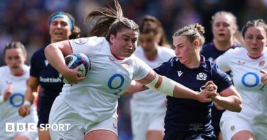 Maud Muir carries the ball