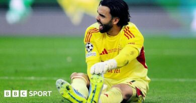David Raya of Arsenal goes down holding his foot during the 2026 UEFA Champions League final against Paris St-Germain