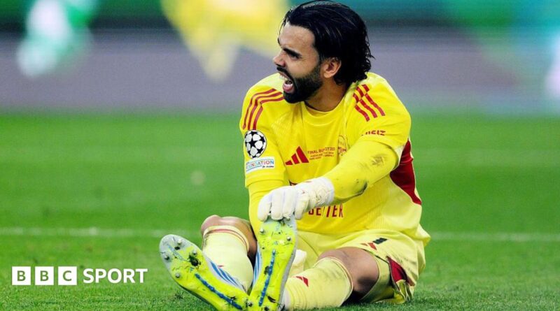 David Raya of Arsenal goes down holding his foot during the 2026 UEFA Champions League final against Paris St-Germain