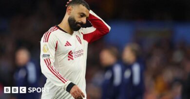 Referee Michael Salisbury signals before he awards a second goal to Matheus Cunha of Manchester United after a VAR check 