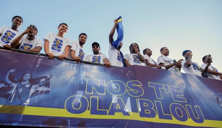Curaçao players take part in a parade celebrating their qualification for the 2026 FIFA World Cup, in Willemstad, Curacao, Wednesday, Nov. 19, 2025. (AP Photo/Endrymar Martis)