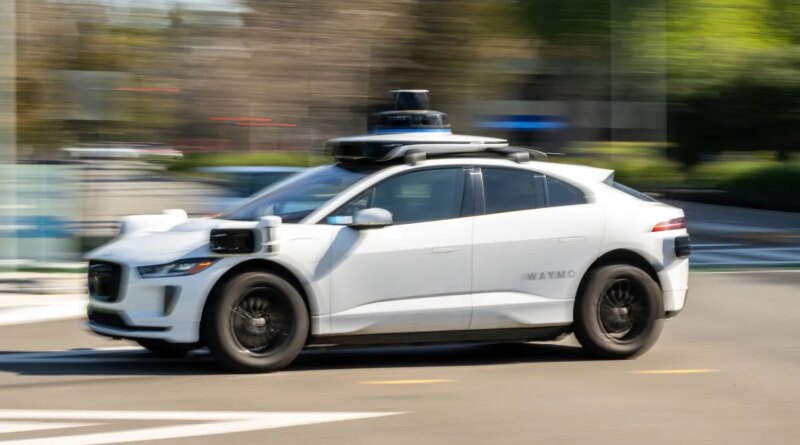 A Waymo autonomous taxi outside the Google headquarters