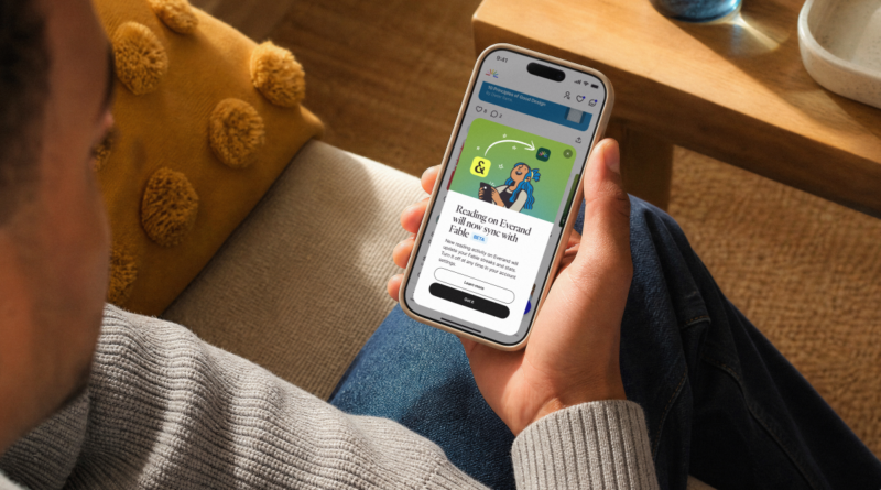 person looking at Everand app on smartphone