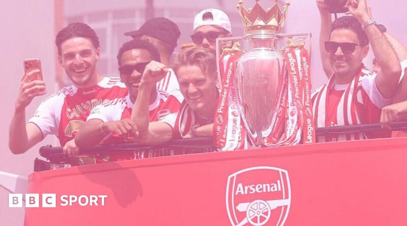 Arsenal players and manager Mikel Arteta with the Premier League trophy
