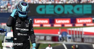 George Russell celebrates after claiming pole position in Austria 