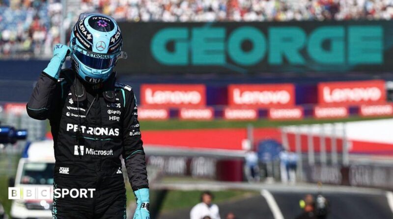 George Russell celebrates after claiming pole position in Austria