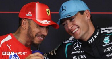 Lewis Hamilton and George Russell share a joke during the official news conference after qualifying for the Barcelona-Catalunya Grand Prix