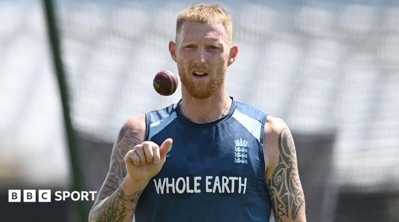 Ben Stokes, wearing a blue England vest, tosses a ball in the air