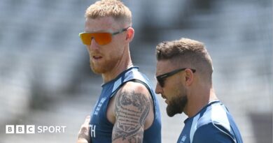 Ben Stokes raises his arms to celebrate a wicket 