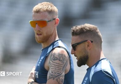 Ben Stokes raises his arms to celebrate a wicket 