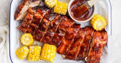Grilled ribs and corn with bbq sauce.