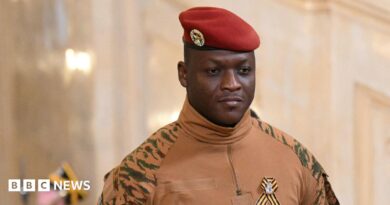 Burkina Faso's military leader Ibrahim Traore wearing a military uniform with a red hat