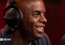 Trevor Nelson smiling while speaking into a radio mic