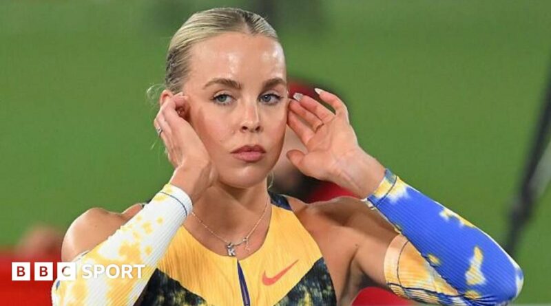 Keely Hodgkinson poses on a throne after breaking the world indoor 800m record