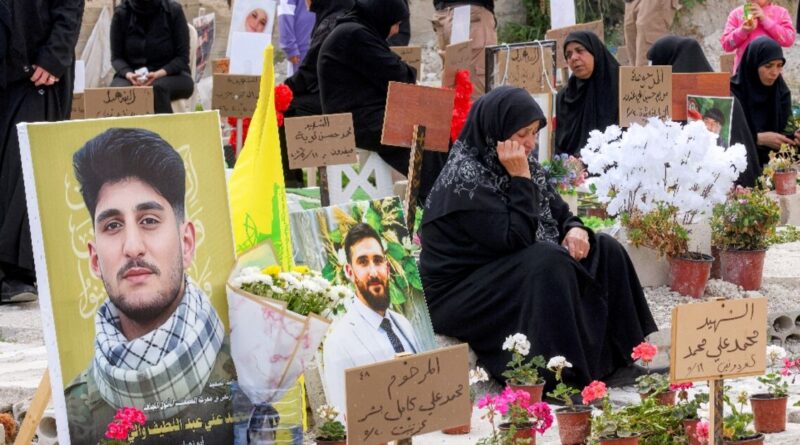 Displaced families bury Hezbollah dead in temporary graves