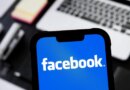 photo illustration of Facebook logo is seen displayed on a smartphone.