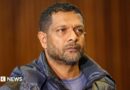 South Africa's deputy head of crime intelligence Feroz Khan is seen in court. He has short hair and a short beard