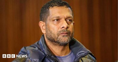 South Africa's deputy head of crime intelligence Feroz Khan is seen in court. He has short hair and a short beard