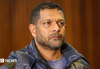 South Africa's deputy head of crime intelligence Feroz Khan is seen in court. He has short hair and a short beard