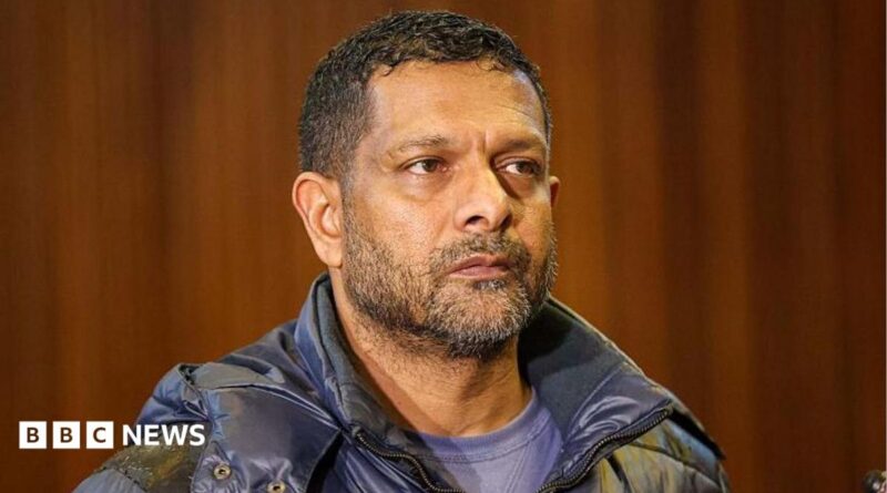 South Africa's deputy head of crime intelligence Feroz Khan is seen in court. He has short hair and a short beard