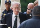 John Bolton arrives in court on Friday