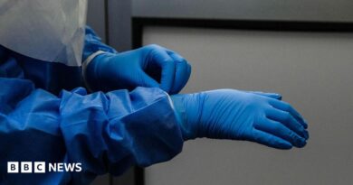A person wearing blue protective gear