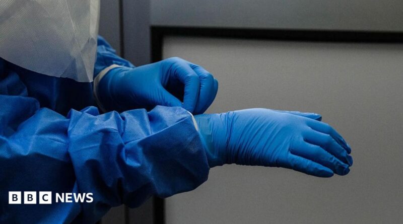 A person wearing blue protective gear