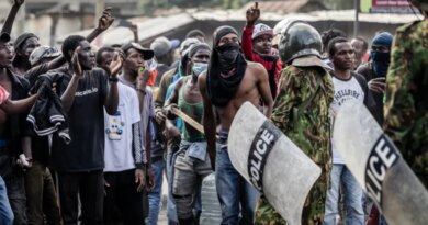 Demonstrators chant slogans as they confront Kenyan police officers during clashes at a demonstration against a controversial US-built Ebola quarantine centre slated to begin operations at Laikipia Air Base in Nanyuki on June 9, 2026. Several Kenyans were arrested on June 9, 2026 in the latest protests against an Ebola quarantine centre being built for US citizens in a tourist town.The centre at Laikipia Air Base in the town of Nanyuki, under the shadow of Mount Kenya, is set to quarantine Americans arriving from the Democratic Republic of Congo (DRC), which is battling a major Ebola outbreak. (Photo by Luis TATO / AFP)