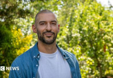 Marios, standing in front of trees