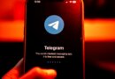 The logo for Telegram chat messenger application arranged on a smartphone.