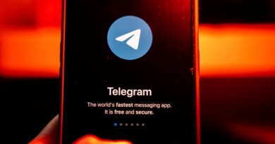The logo for Telegram chat messenger application arranged on a smartphone.