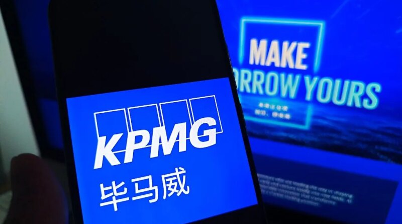 SUQIAN, CHINA - MAY 19, 2026 - A netizen is checking KPMG logo on his mobile phone and KPMG webpage on his computer in Suqian City, Jiangsu Province, China on May 19, 2026. (Photo credit should read CFOTO/Future Publishing via Getty Images)