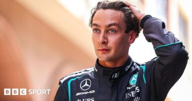 George Russell runs his hand through his hair and looks disappointed following Monaco Grand Prix qualifying