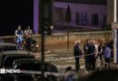 Police near the scene of the blast late at night on a Monaco street