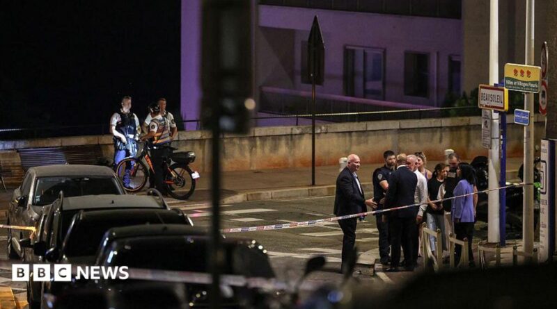 Police near the scene of the blast late at night on a Monaco street