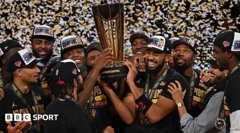 New York Knicks players holding the NBA Championship trophy