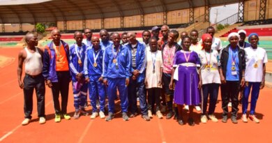 Masters athletes in Meru stretch together before a morning session, turning a dusty village field into an informal training ground for seniors.