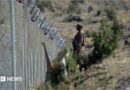 File photo of a soldier standing along the Pakistan-Afghanistan border