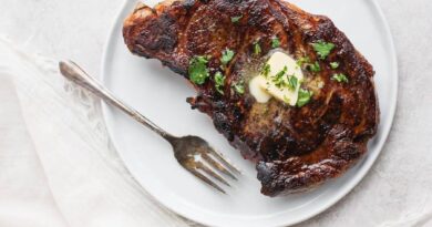 Sous vide steak with butter and fresh parsley on top.