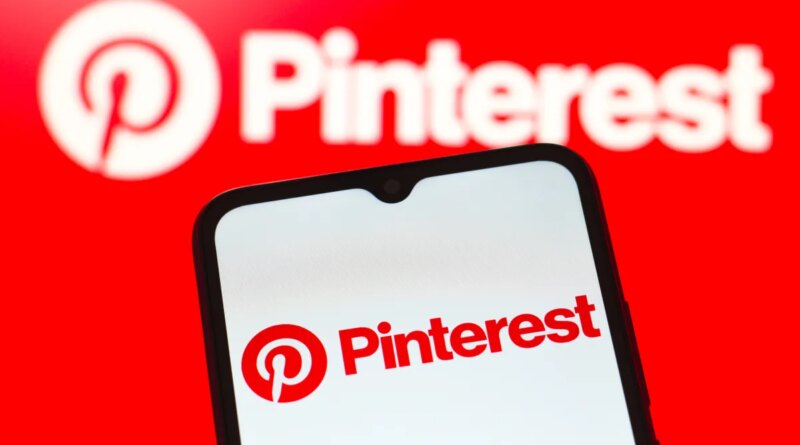 In this photo illustration, the Pinterest logo is seen displayed on a smartphone screen.