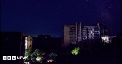 Residential buildings at night during a temporary power outage, which local authorities said was caused by technological disturbances in the peninsula’s energy grid