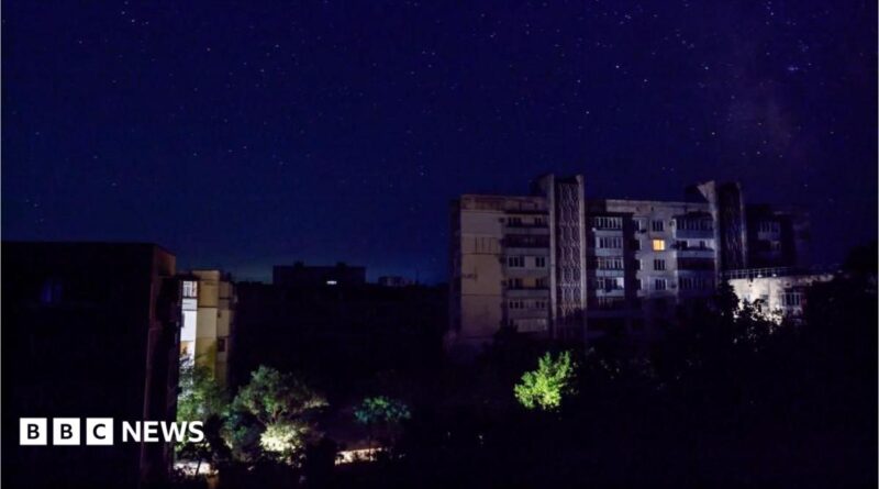 Residential buildings at night during a temporary power outage, which local authorities said was caused by technological disturbances in the peninsula’s energy grid