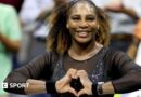 Serena Williams does a heart symbol with her hands while playing at the 2022 US Open