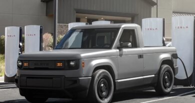 Slate Auto's Blank Slate truck charging at a Tesla Supercharger