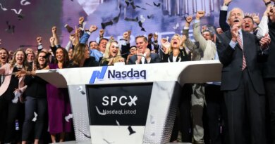 Bret Johnsen (C), SpaceX Chief Financial Officer, and Gwynne Shotwell (center R), SpaceX President and Chief Operating Officer, celebrate as they ring the opening bell at the Nasdaq MarketSite to celebrate the launch of SpaceX’s initial public offering (IPO) in New York on June 12, 2026.