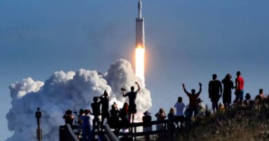 The crowd cheers at Playalinda Beach in the Canaveral National Seashore, just north of the Kennedy Space Center, during the launch of the SpaceX Falcon Heavy rocket, on Feb. 6, 2018. Playalinda is one of closest public viewing spots to see the launch, about 3 miles from the SpaceX launchpad 39-A. (Joe Burbank/Orlando Sentinel/Tribune News Service via Getty Images)