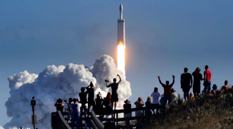 The crowd cheers at Playalinda Beach in the Canaveral National Seashore, just north of the Kennedy Space Center, during the launch of the SpaceX Falcon Heavy rocket, on Feb. 6, 2018. Playalinda is one of closest public viewing spots to see the launch, about 3 miles from the SpaceX launchpad 39-A. (Joe Burbank/Orlando Sentinel/Tribune News Service via Getty Images)